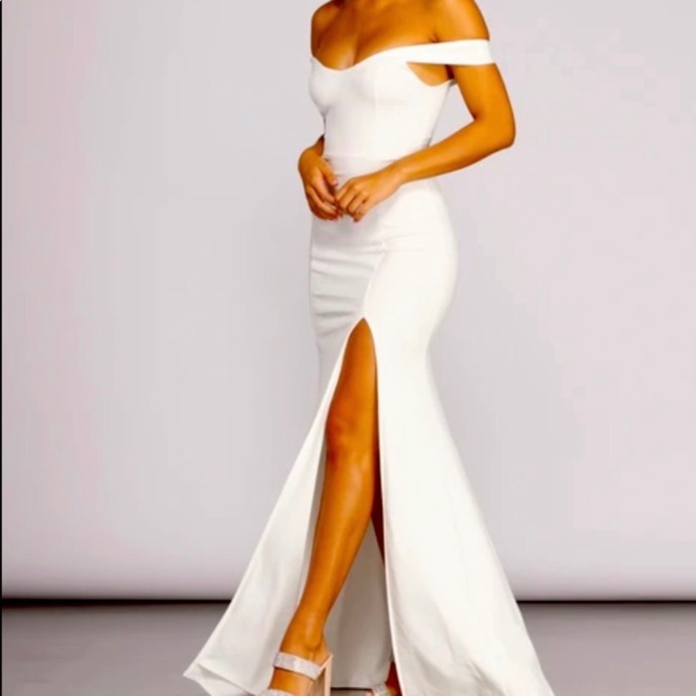 White gown off the shoulder with slit. Never worn. Stretchy material.